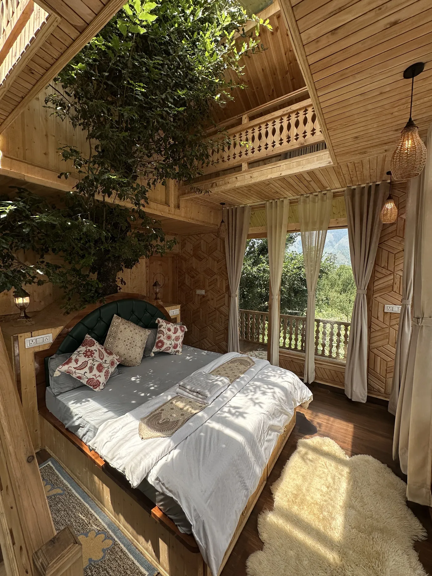 Duplex bed under the tree with sun through the windows